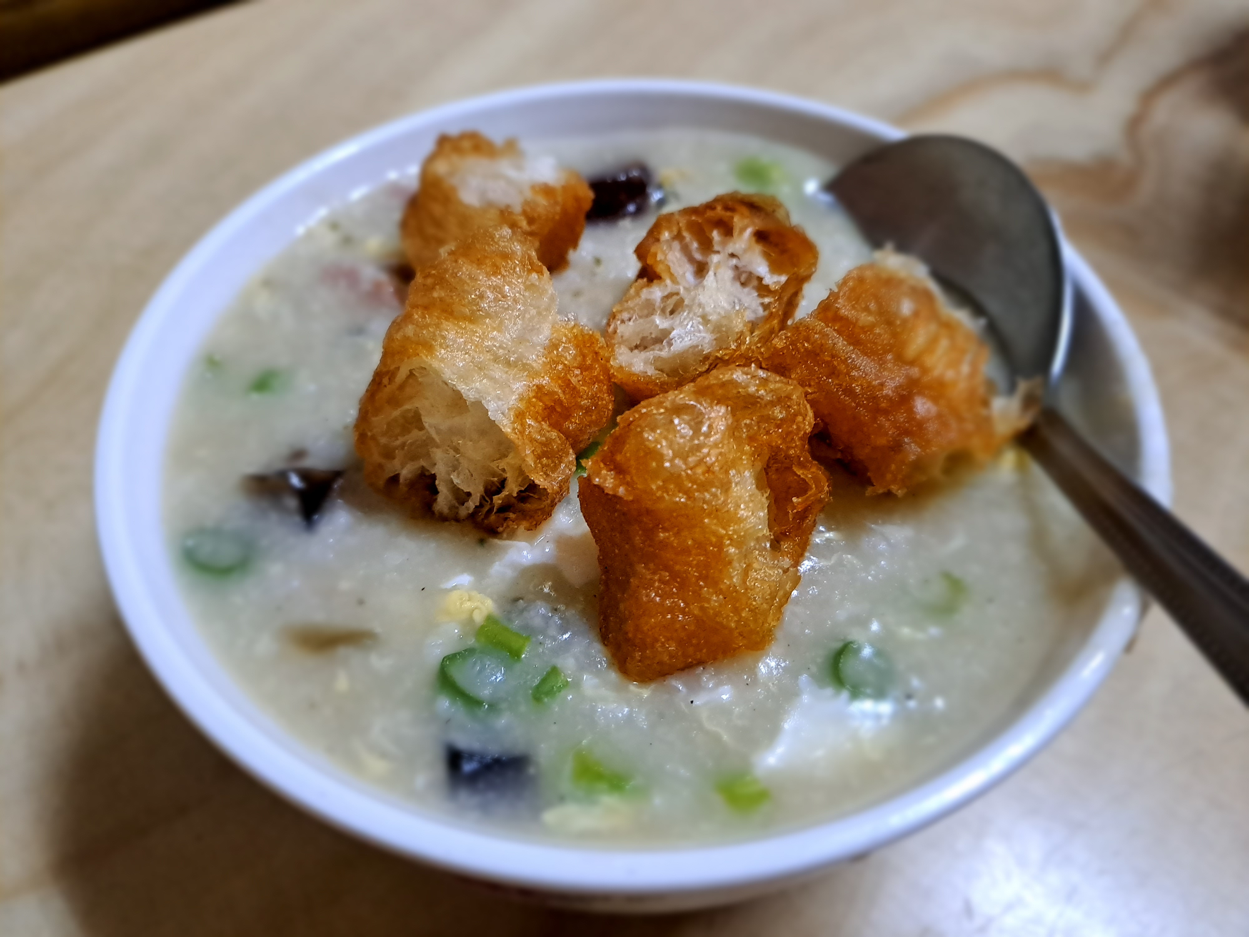 Pork and Century Egg Congee (皮蛋瘦肉粥) with deep fried Chinese breadsticks (油條)